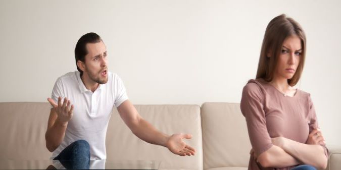 couple arguing on sofa